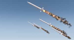 A row of intercontinental ballistic missiles launching in a desert on a blue sky backgrund