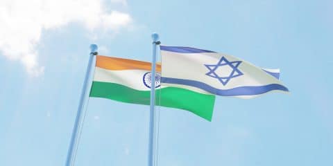 India and Israel, two flags waving against blue sky. 3d image