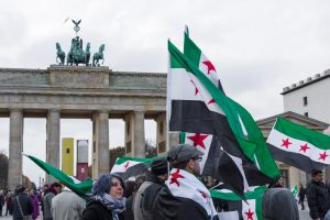 BERLIN - NOVEMBER 12 2017: Protest action of the Syrian opposition near Brandenburg Gate against the Russian Army in Syria.