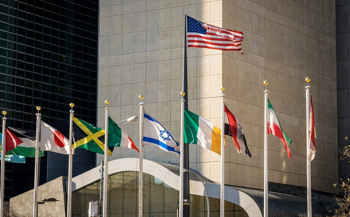 Flags of the world with the United States and Israel displayed prominently.
