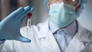 Lab Researcher Holding Virus Sample, Illegal Clinical Trials, Ge