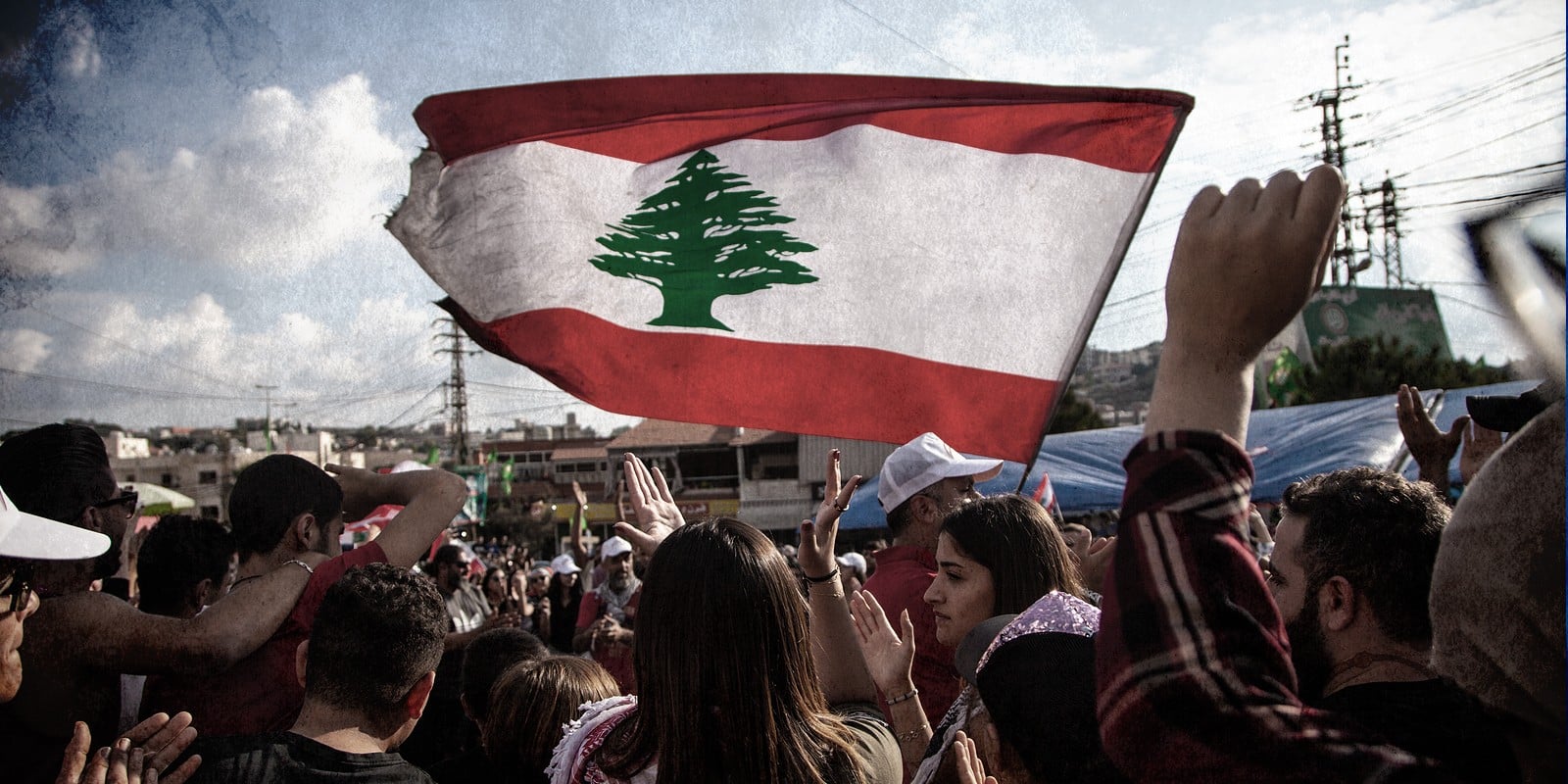 Lebanese Protesters rising Lebanon Flag