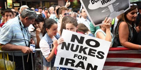 NEW YORK CITY - JULY 22 2015: thousands rallied in Times Square to oppose the President's proposed nuclear deal with Iran. Rally attendees with anti-Iran signs