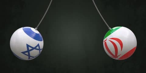 Balls on ropes in the colors of the national flags of Israel and Iran are directed towards each other