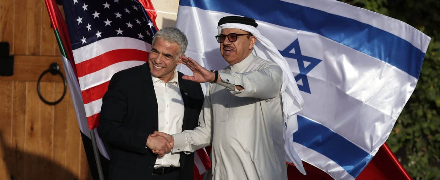 Israeli Foreign Minister Yair Lapid (L) welcomes Bahraini Foreign Minister Abdullatif bin Rashid Al Zayani in Sde Boker, southern Israel s Negev desert, on March 27, 2022
