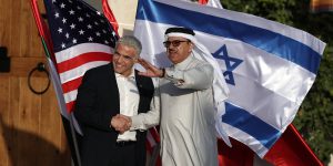Israeli Foreign Minister Yair Lapid (L) welcomes Bahraini Foreign Minister Abdullatif bin Rashid Al Zayani in Sde Boker, southern Israel s Negev desert, on March 27, 2022