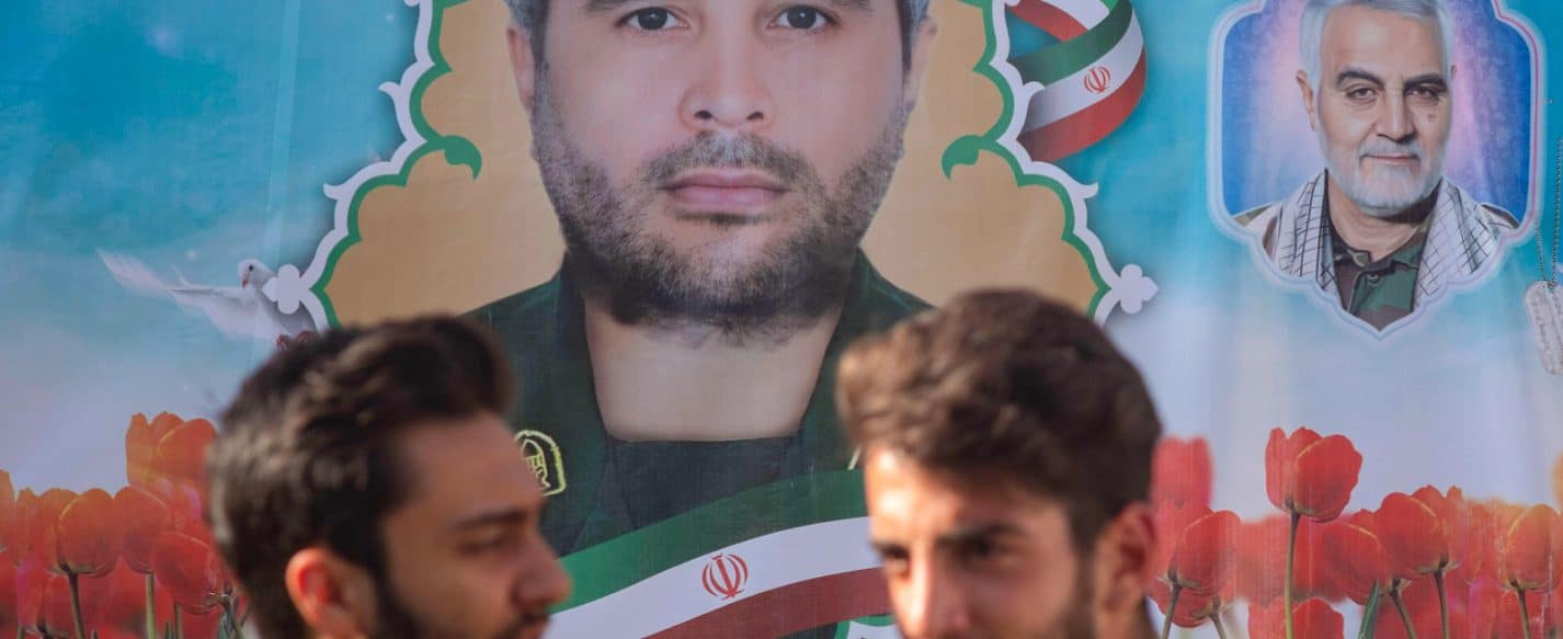 University students stand under a portraits of the assassinated Islamic Revolutionary Guard Corps™ Commander, Colonel Sayyad Khodai, and the former Commander of IRGC™s Quds Force, General Qasem Soleimani