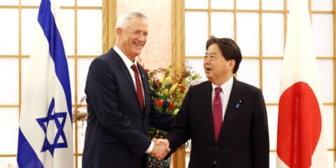 Defense Minister Benny Gantz shakes hands with Japanese Foreign Minister Yoshimasa Hayashi