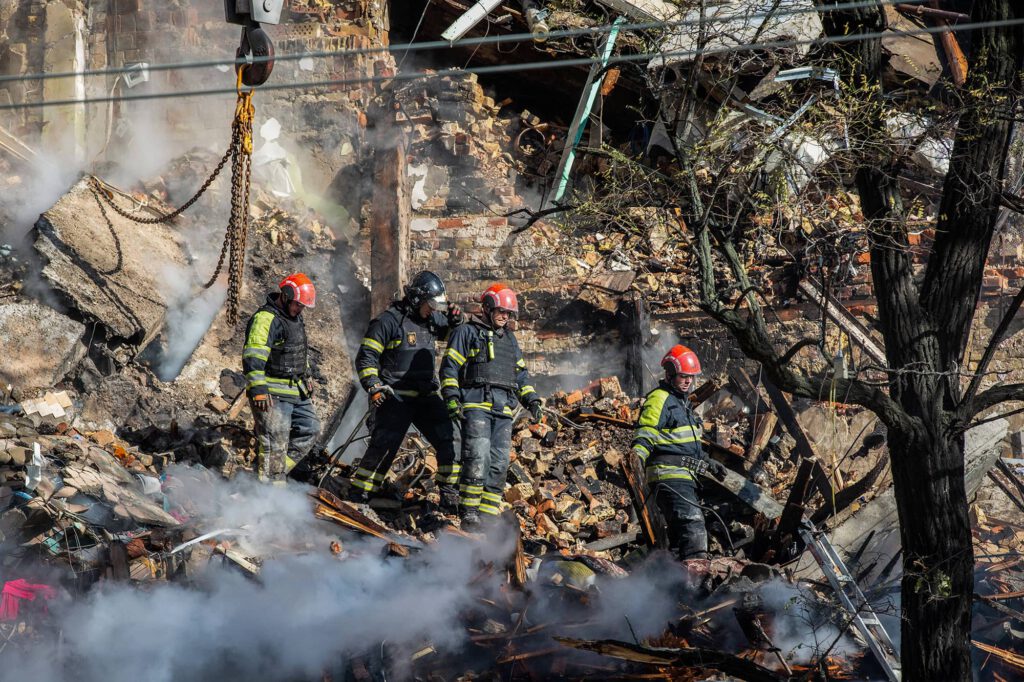 October 17, 2022, Kyiv, Ukraine Ukrainian rescuers work at the site of a residential building destroyed