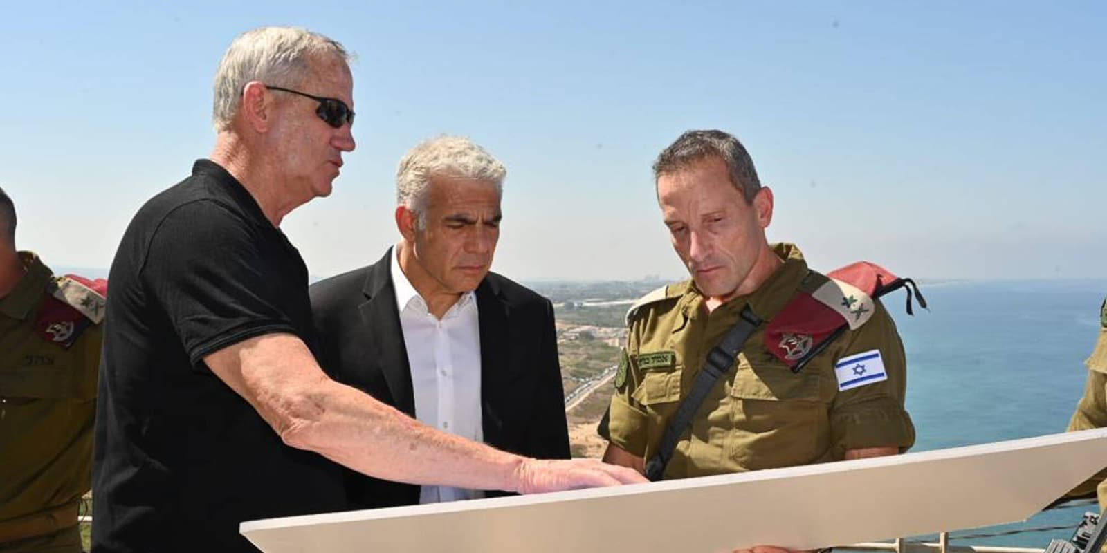 Lebanese Border, Israel: Israeli Prime Minister YAIR LAPID (C) and Defense Minister BENNY GANTZ (L) tour the IDF Northern Command near the Lebanese border and hold an operational assessment with Commander of the IDF Northern Command Maj.-Gen. AMIR BARAM (R).