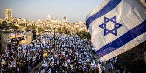 February 20, 2023, Jerusalem, Israel: Protestors wave Israeli flags during a demonstration Mass demonstrations against the judicial reform