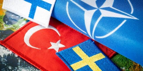 15, May, 2022, Turkish flag next to the flags of Finland and Sweden Concept of a political conflict between a member of the North Atlantic Pact and candidates aspiring to join NATO