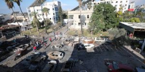 Palestinians evacuate the Al-Ahli Arabi Baptist Hospital