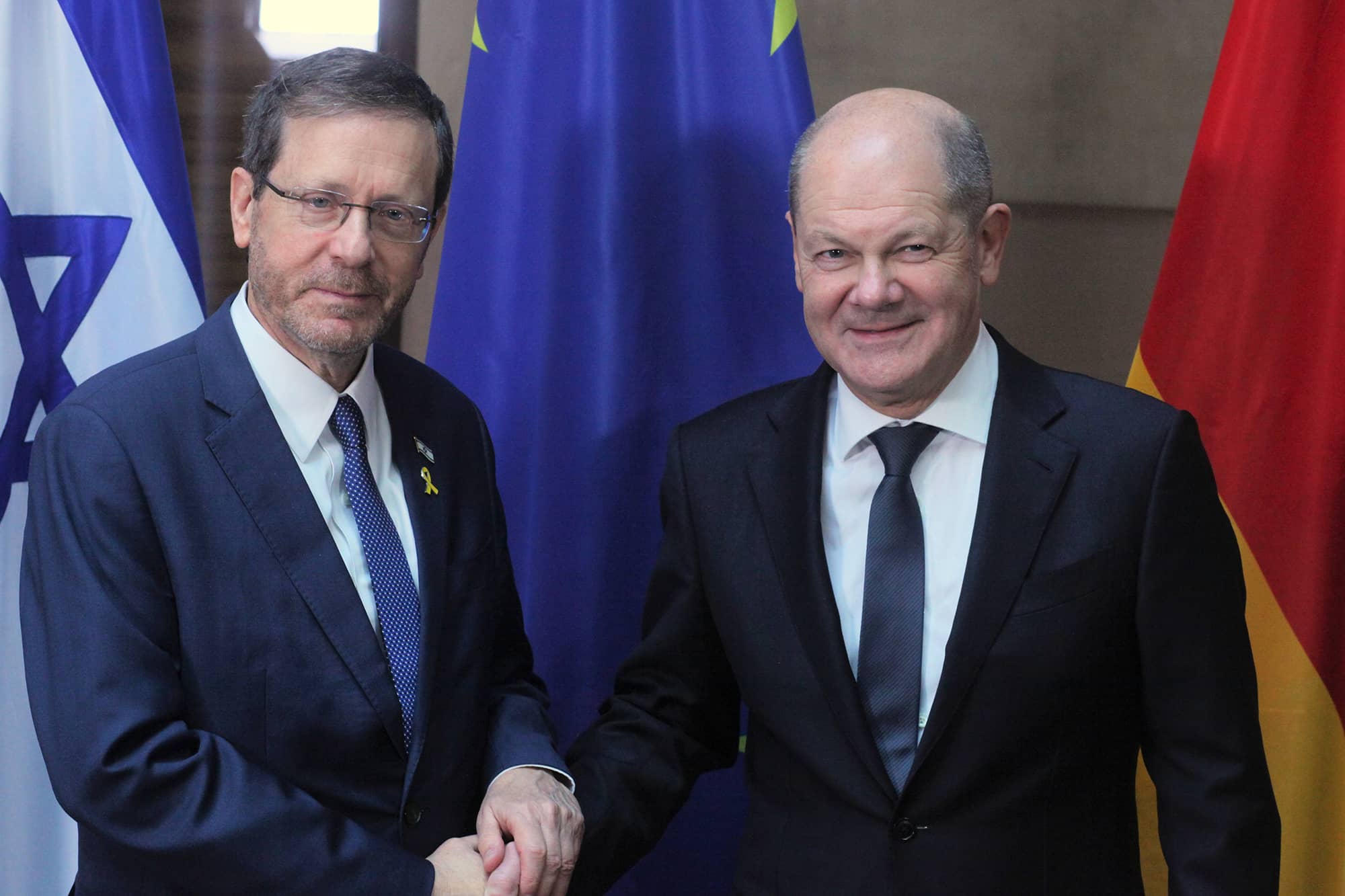 Olaf Scholz and Isaac Herzog.