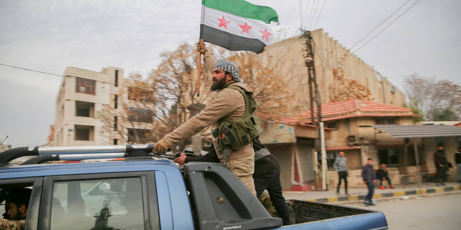 Syrian Civil War Anti-government forces gather around vehicles in Salamiyah