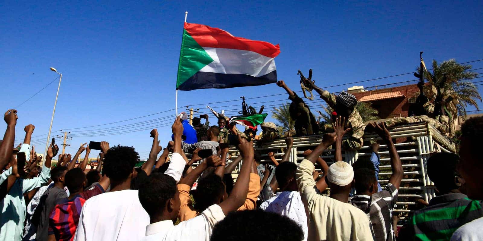 people celebrating the Sudanese army s retaking of Wad Madani