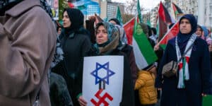 November 10, 2024, Beyoglu, Istanbul, Turkey: Demonstrators hold placards during a pro-Palestine march in solidarity with Palestinians in Gaza from Taksim Square to Germany ConsulateÃ‚ General in Istanbul onÃ‚ NovemberÃ‚ 10,Ã‚ 2024. Beyoglu Turkey - ZUMAu194 20241110_zip_u194_004