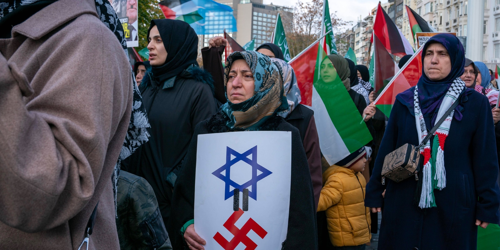November 10, 2024, Beyoglu, Istanbul, Turkey: Demonstrators hold placards during a pro-Palestine march in solidarity with Palestinians in Gaza from Taksim Square to Germany ConsulateÃ‚ General in Istanbul onÃ‚ NovemberÃ‚ 10,Ã‚ 2024. Beyoglu Turkey - ZUMAu194 20241110_zip_u194_004