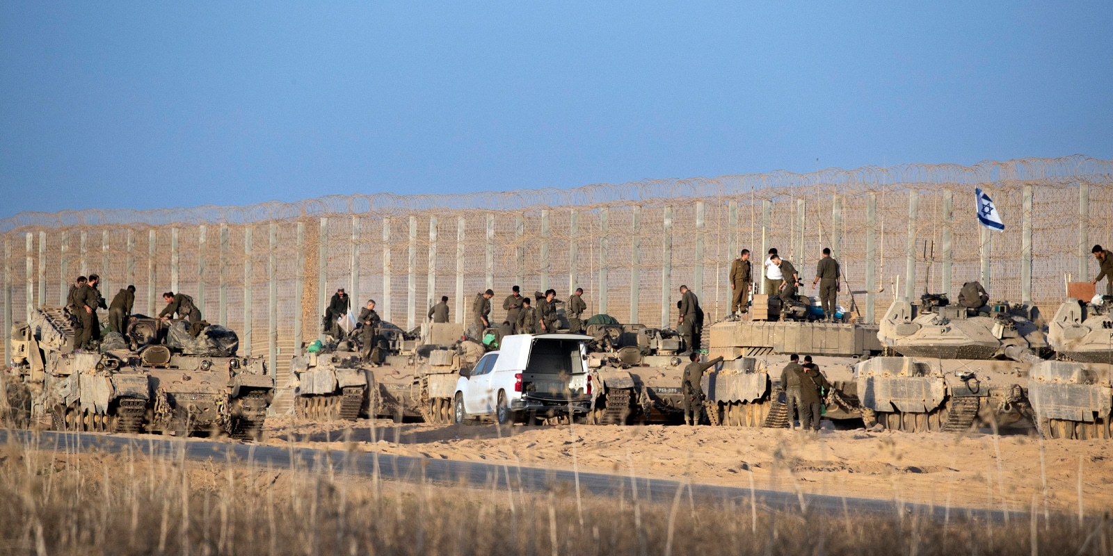 Israeli tanks and armored personnel carriers on the border fence with the Gaza :Strip. Photo Credit IMAGO / UPI Photo