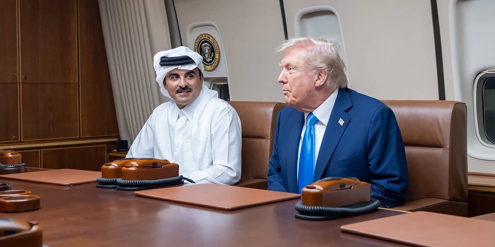 US President Donald Trump (R) held talks with Qatar s Emir Sheikh Tamim bin Hamad Al-Thani (C) aboard Air Force One in Doha on Saturday, October 25, 2025, during a refuelling stop en route to Malaysia for the ASEAN summit. QAT2025102505 QatarixEmirixDiwan