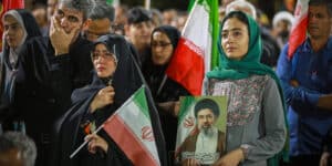 March 24, 2026, Iran, Iran: Iranian pro-government supporters wave national flags during a rally. Iran said it fired cruise missiles at the USS Abraham Lincoln aircraft carrier, according to a statement carried by state television, amid escalating conflict following strikes by Israel and the United States that have expanded tensions across the Middle East. Iran Iran - ZUMAi98_ 20260324_zih_i98_008 Copyright: xIranianxSupremexLeader SxOfficex