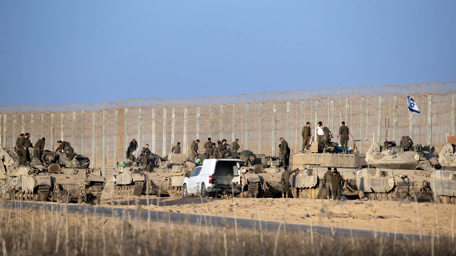 Israeli tanks and armored personnel carriers on the border fence with the Gaza Strip as they prepare to move on Monday, October 20, 2025 as they deploy to a gate and then into the eastern side of the Gaza Strip. ISR20251020011 JimxHollander